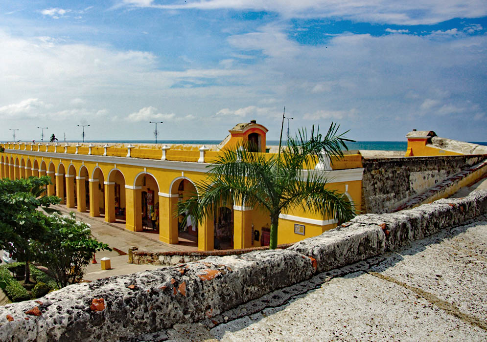 Long yellow building used as a marketplace