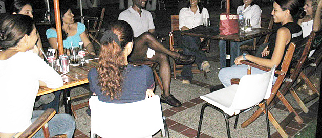 Black Man meeting many Colombian women with only one chair vacant