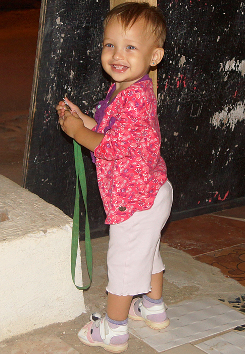 Smiling toddler on her feet