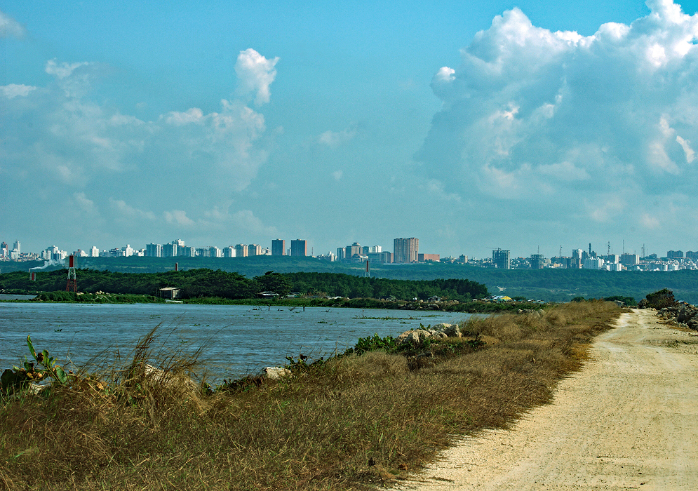 Barranquilla and Dirt Road Barranquilla from the mouth of the Magdalena River and the dirt road that leads to the mouth of the river