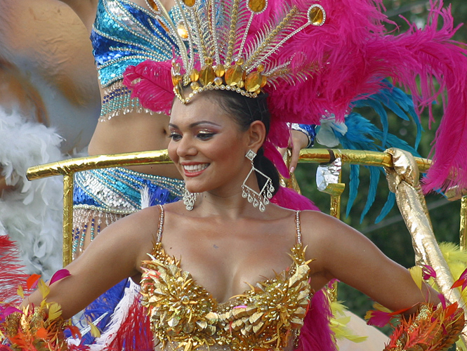 Beautiful Barranquilla Woman Beautiful Latin woman wearing a gold top in the carnival parade in Barranquilla