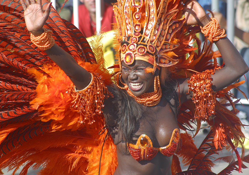 Carnival Joy Black Barranquilla Carnival dancer in orange feathers