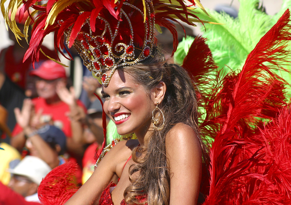 Beautiful blond Colombian woman in red dress during the parade celebration for the Barranquilla Carnival