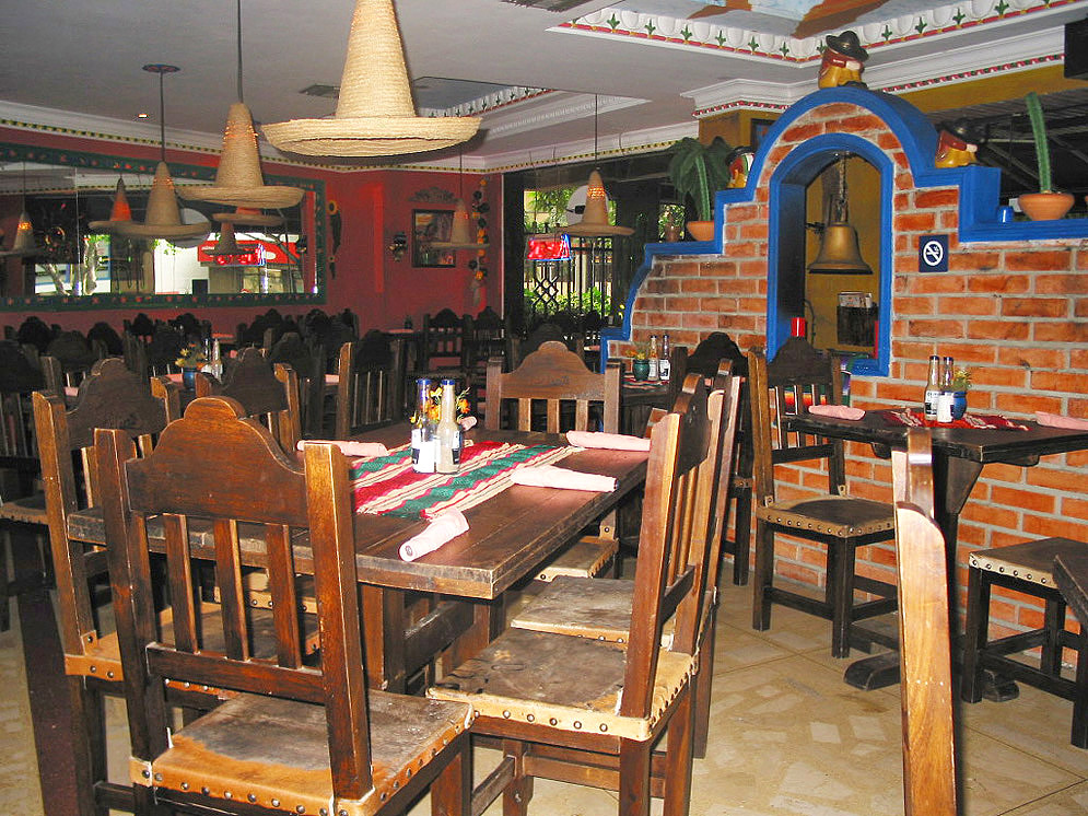 Barranquilla Mexican restaurant with wooded tables and sombrero lambs