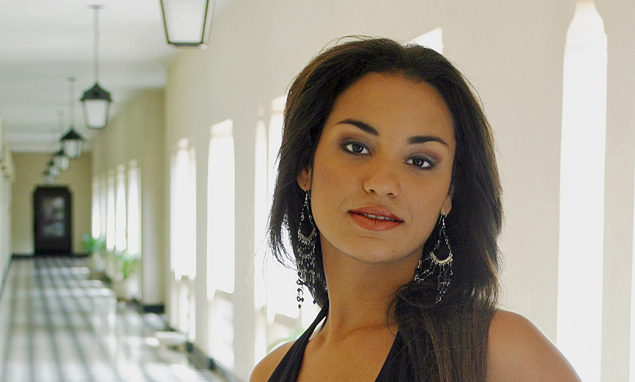 A beautiful Latin woman on a long hallway representing the caliber of woman from International Introduction services