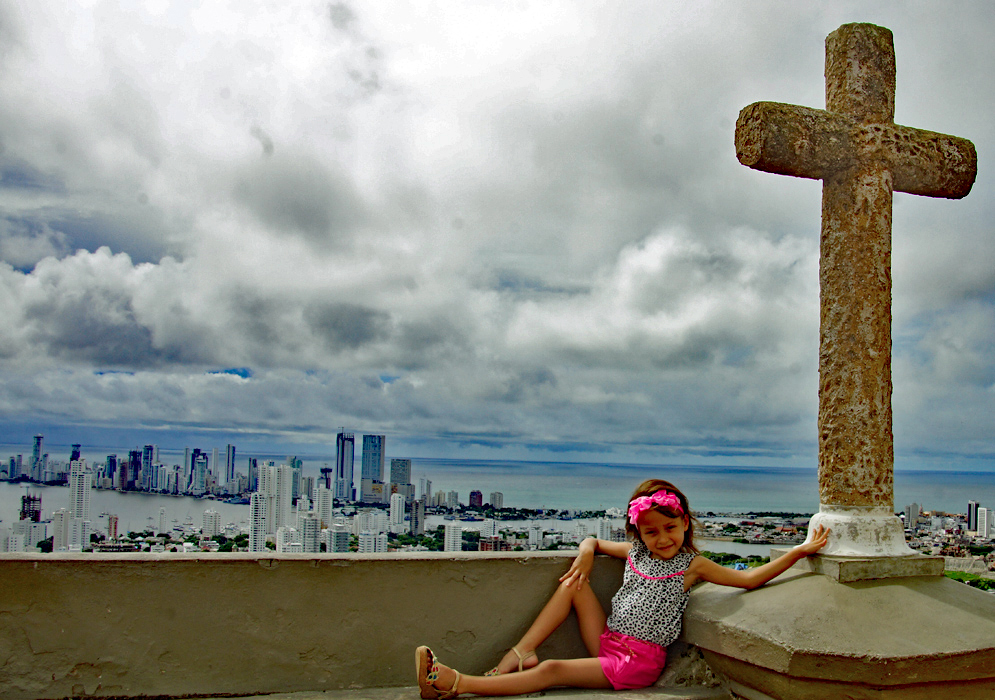 Cross and Child Five year old child next to a cross overlooking Bocagrande Cartagena