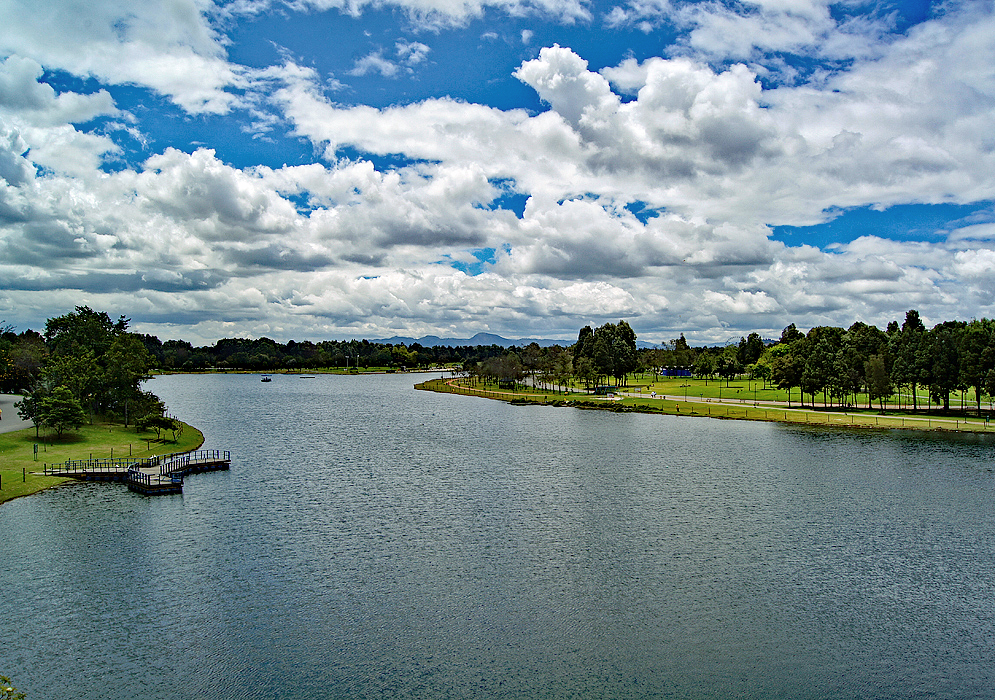 Bogotá Park Simon Bolivar A park with a lake, grass and trees