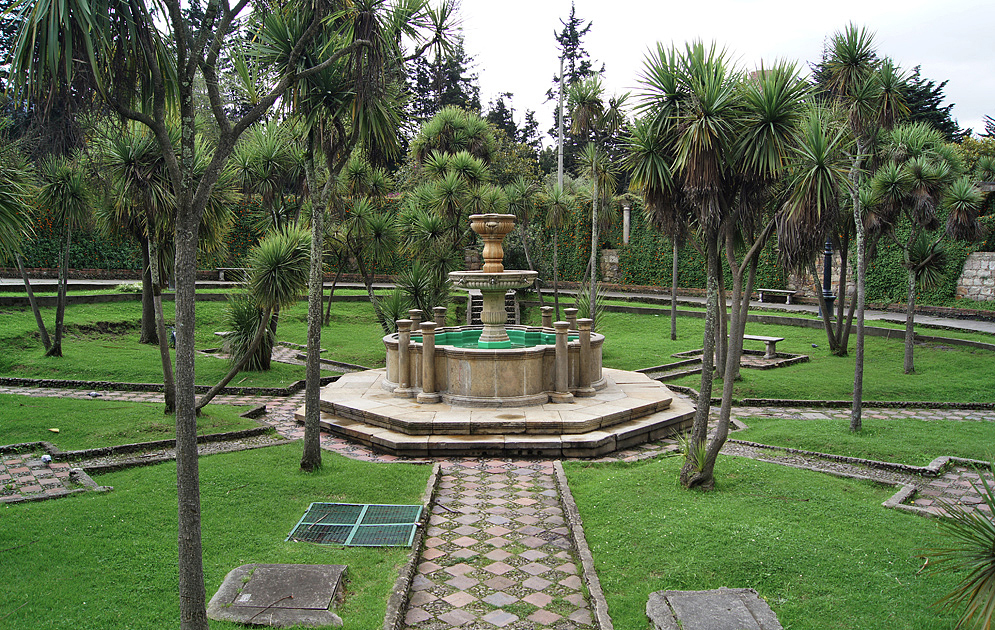 Bogotá Fountain Park A fountain in a park surrounded by yucca trees