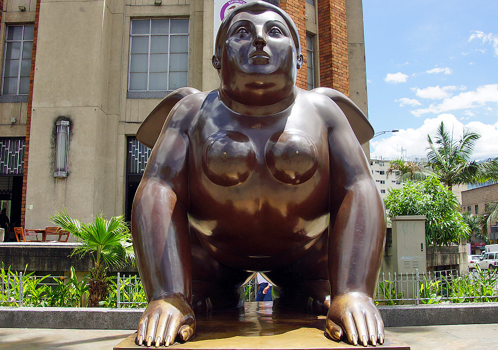 Fat naked woman on all fours with small wings on her back