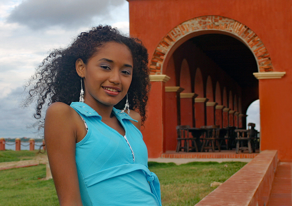 Caribbean woman on the coast at the Castle of Salgar in Colombia