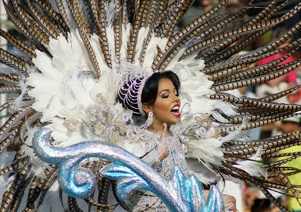 Man in skeleton costume leading Barranquilla Carnival dancers