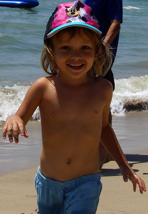 Young girl running on the beach