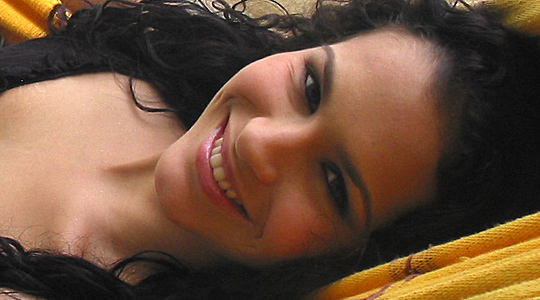 Attractive Colombian woman laying on a hammock