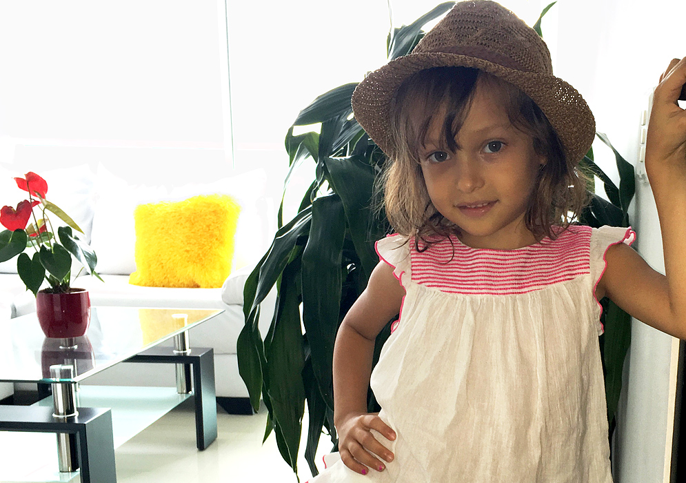 Little girl looking cool wearing her hat