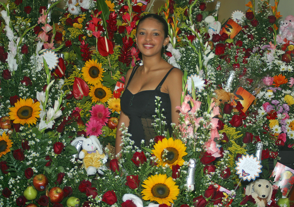 Colombian woman surrounded by exotic flowers