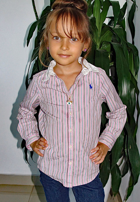 Handsome little girls wearing a pink stripe shirt