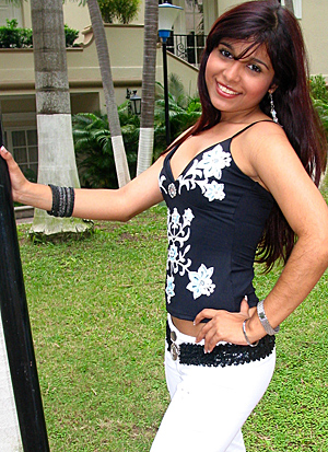 A beautiful Hispanic wife posing around palm trees