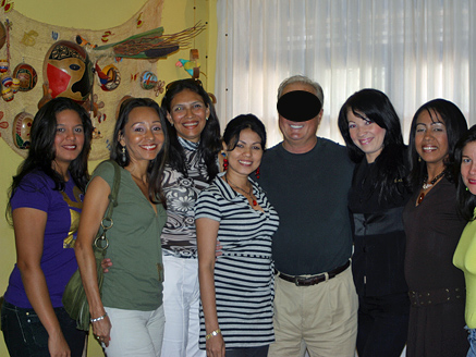 A pleased man posing with attractive Colombian women after his introductions