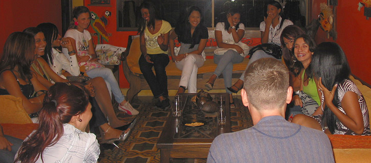Group of South American women gathered for a relaxed introduction with a foreign gentleman