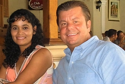 American man and Colombian woman smiling together