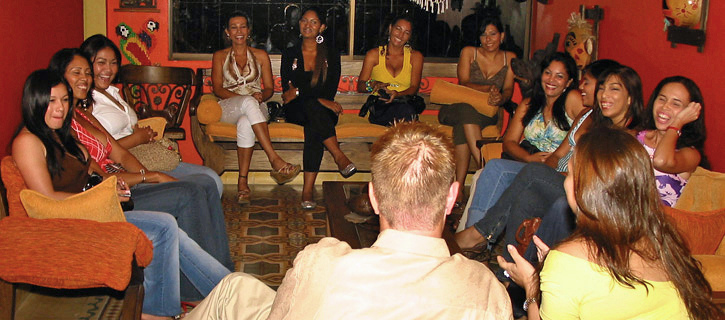 Lively group of Colombian women laughing during an evening social
