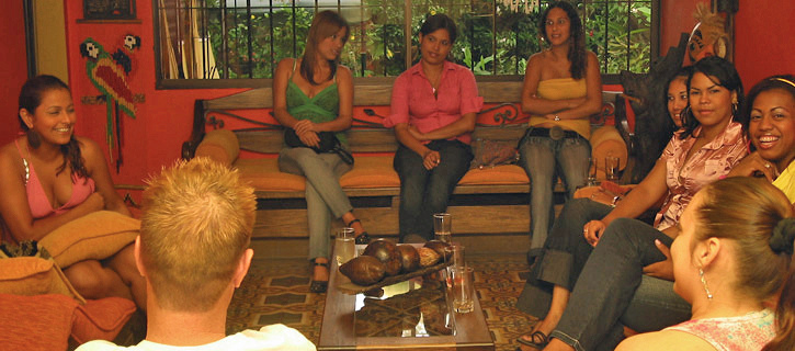 Small group of Colombian women in a cozy lounge at a relaxed social