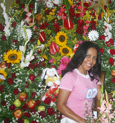 Loyal Colombian woman surrounded by flowers