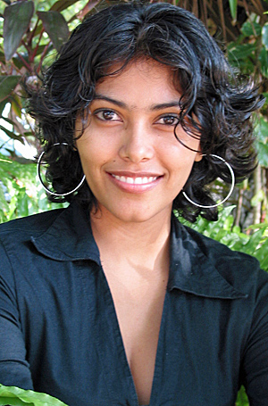 A beautiful mail order bride with short black hair smiling