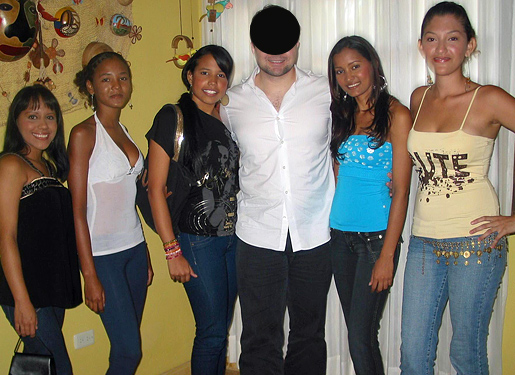 One man posing for a photo in the middle of eight South American women that he was introduced to