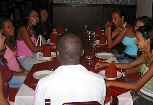A small group of Colombian women meeting one black man during an International Introductions romance tour