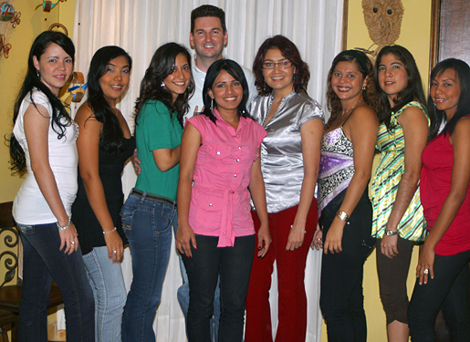 International Matchmaking Meetup Colombia Colombian women seated around a table talking with an international guest during a friendly matchmaking meetup