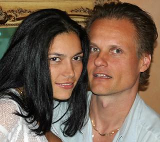 Jamie, the owner of International Introductions and wife leaning together with soft smiles