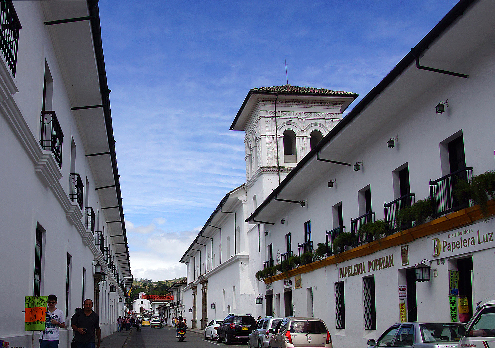 A street surrounded by white buildings