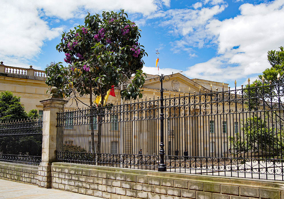 The front of the President's Palace behind a black metal fence