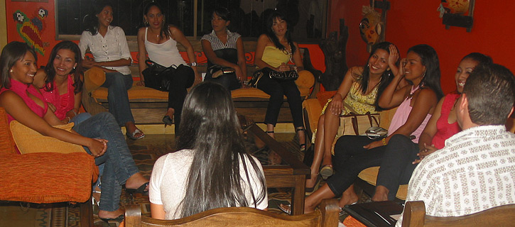 One man being introduced to a small group of happy Latin women