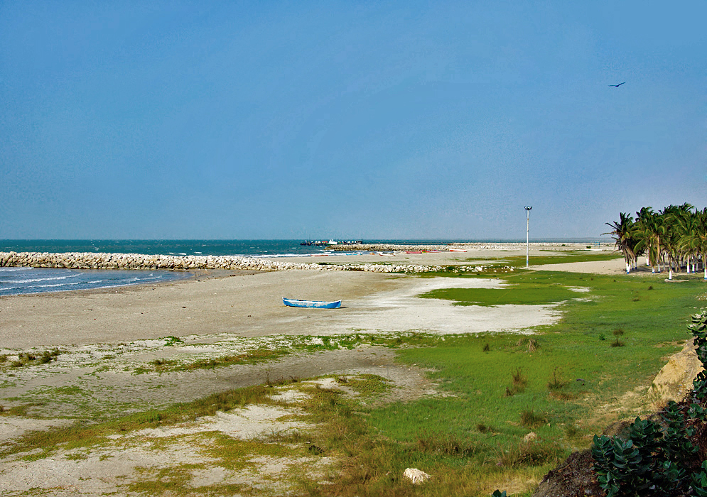 Lone blue boat on the beach