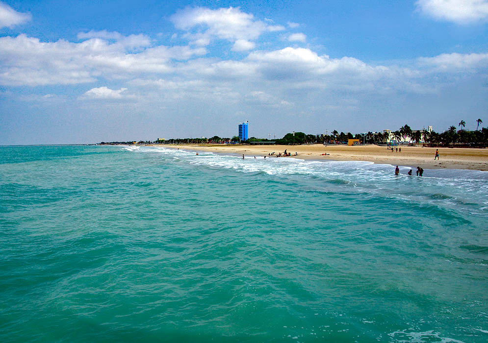 Riohacha beach north of the pier against the green blue ocean