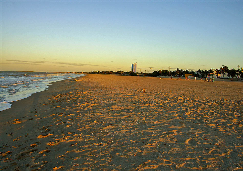 Wide beach under sunset light
