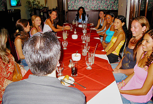 A small group of Latin women meeting one man during a romance tour