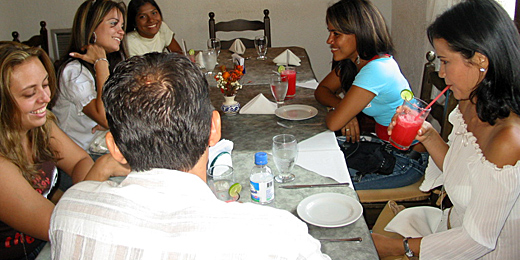 A small group of Latin women meeting one man during a romance tour