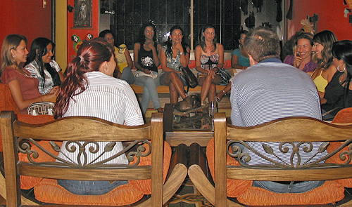 International Introductions Personal Introductions A small group of women meeting one man during a romance tour