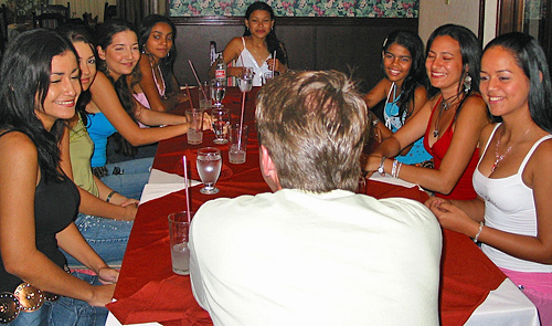 International Introductions Personal Introductions A small group of women meeting one man during a romance tour