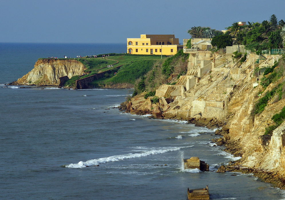 Salgar Castle The yellow Castle Salgar and shoreline cliffs in the foreground during sunset