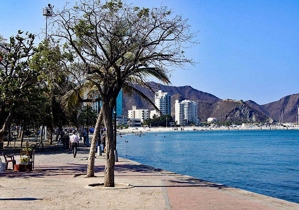 Walkway, white sands and boat harbor in Santa Marta, Colombia