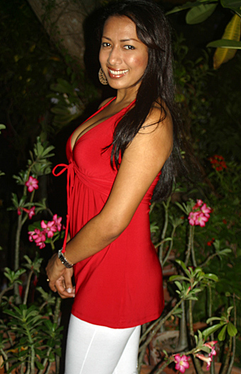 Single Latin woman wearing a purple dress
