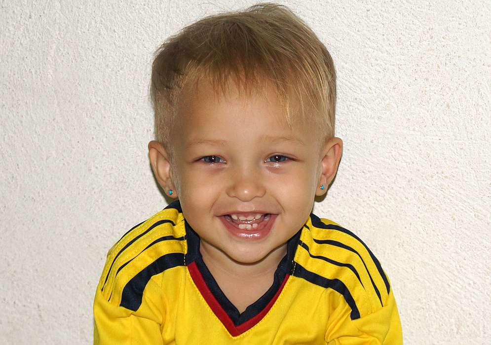 Smiling in her soccer shirt