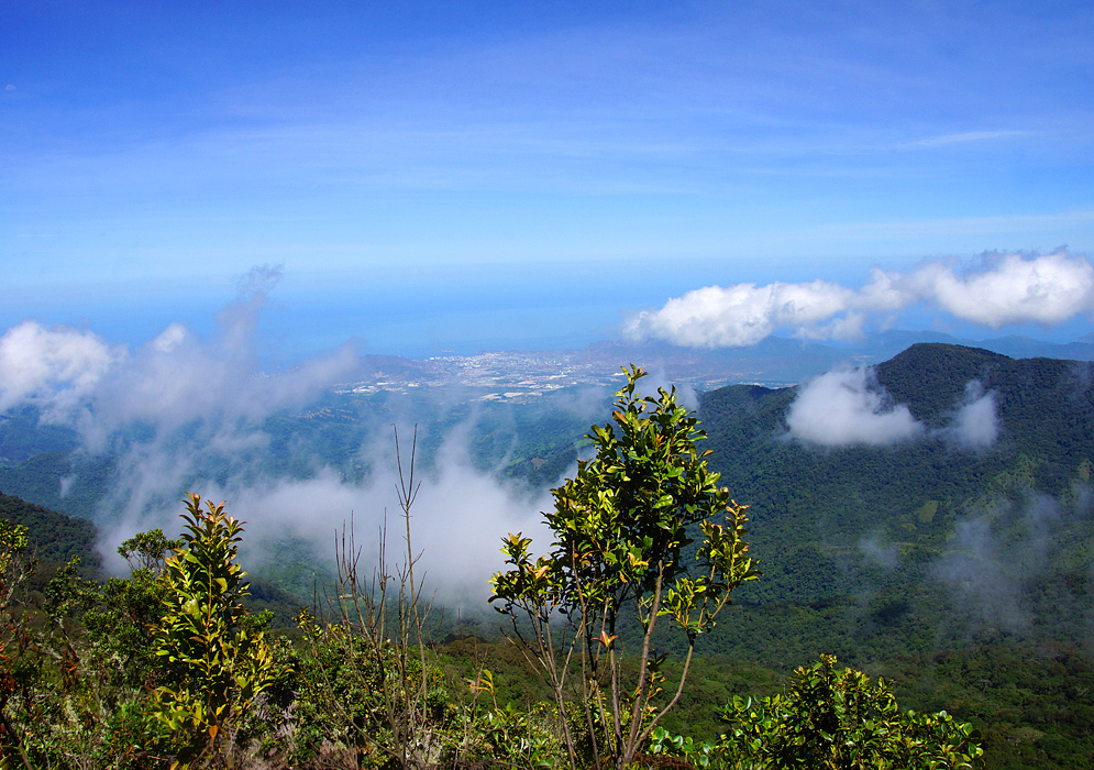 Vista of Santa Marta from Kennedy mountain on a clear day with white clouds forming