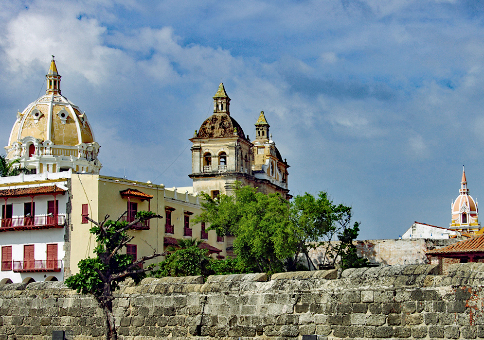 Three church towers in view from inside the stone wall city