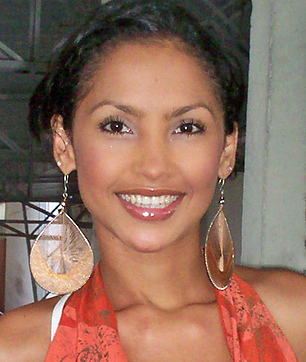 Young Latin Woman with Big Earrings A young Latin woman with tied-back black hair, large round earrings, and a bright smile representing profiles from 18 years old to 20 years old